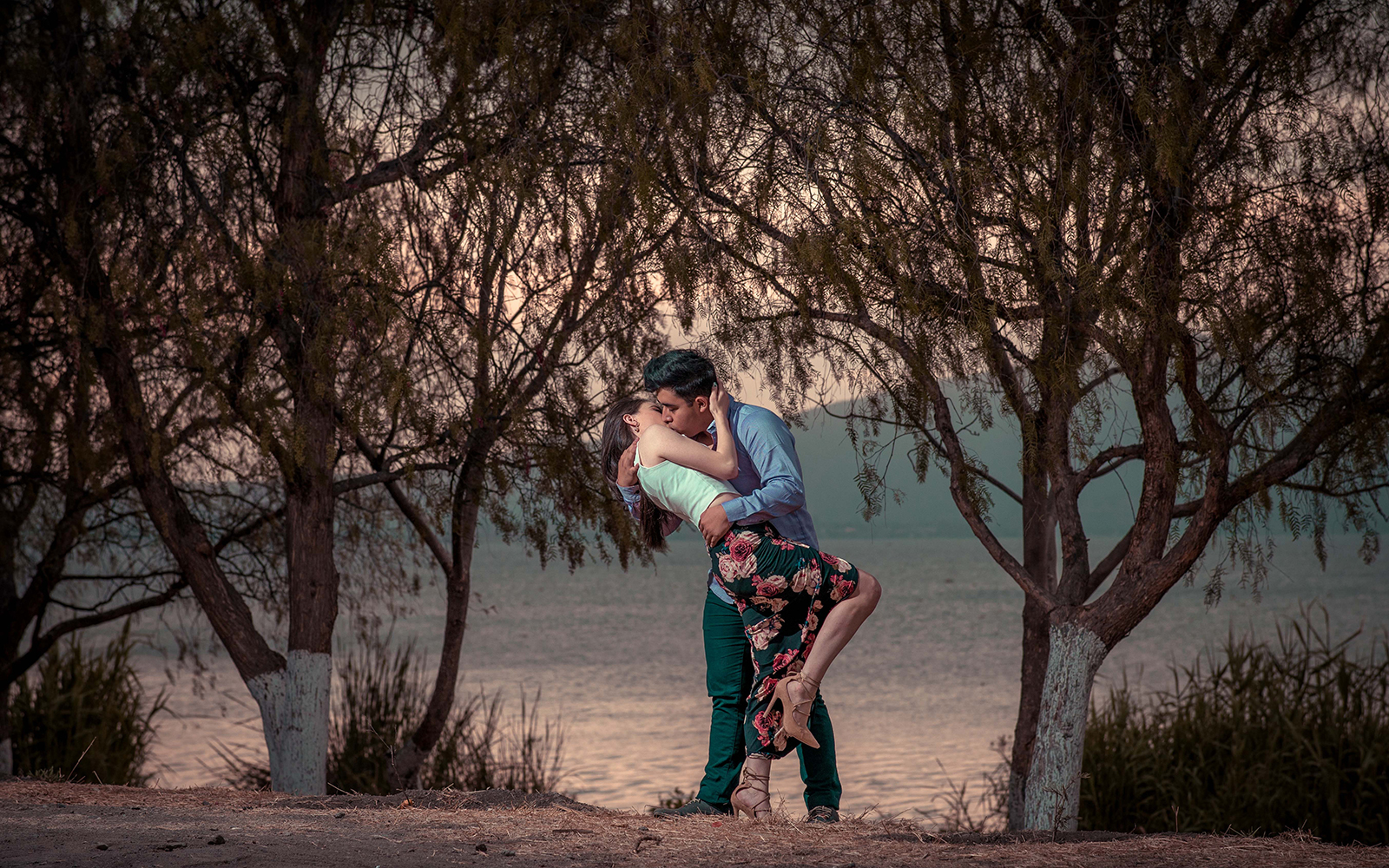 man and woman kissing